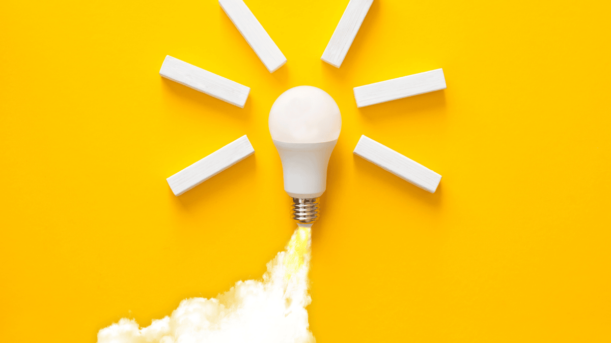 Two entrepreneurs working on laptops in a cozy cafe, planning their travel startup